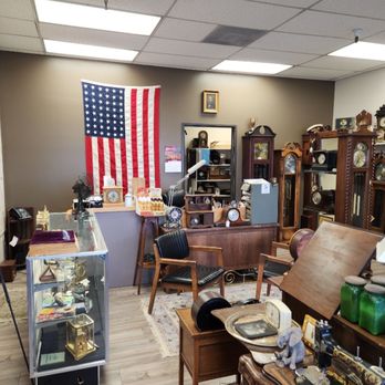 Heirloom Clocks - The showroom, and a 48-Star flag in honor of "State 48" - Clock Repair Near Me - Scottsdale, Arizona Heirloom Clocks - The showroom, and a 48-Star flag in honor of "State 48" - Clock Repair Near Me - Scottsdale, Arizona