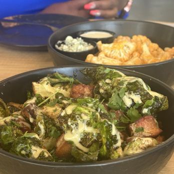 Sonder - Brilliant Brussel sprouts with pork belly. The fish in the rear is the buffalo cauliflower, which was not spicy at all. - American Near Me - Bakersfield, California Sonder - Brilliant Brussel sprouts with pork belly. The fish in the rear is the buffalo cauliflower, which was not spicy at all. - American Near Me - Bakersfield, California