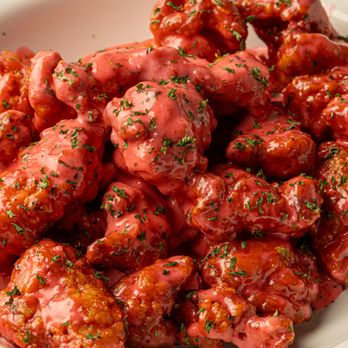 Sauce Boss Wings - a white bowl filled with sauce - Fast Food Near Me - Bronx, New York Sauce Boss Wings - a white bowl filled with sauce - Fast Food Near Me - Bronx, New York