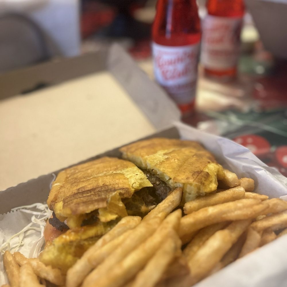 Milly's Dominican Kitchen - Res Patacon -- flavorful beef is sandwiched between two plantain buns. - Dominican Near Me - Cape Coral, Florida