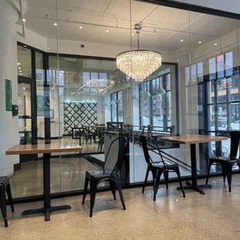 Crisp & Green - a dining area with tables and chairs - Salad Near Me - Minneapolis, Minnesota