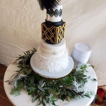 Cotton Leigh Bakery - a three tiered cake decorated with feathers - Bakeries Near Me - Sylva, North Carolina