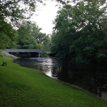 The Hub - a bridge over a river in a park - New American Near Me - Cedarburg, Wisconsin The Hub - a bridge over a river in a park - New American Near Me - Cedarburg, Wisconsin