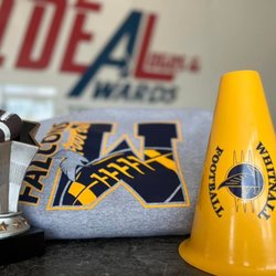 Ideal Logos & Awards - Promotional items, trophies, and apparel.