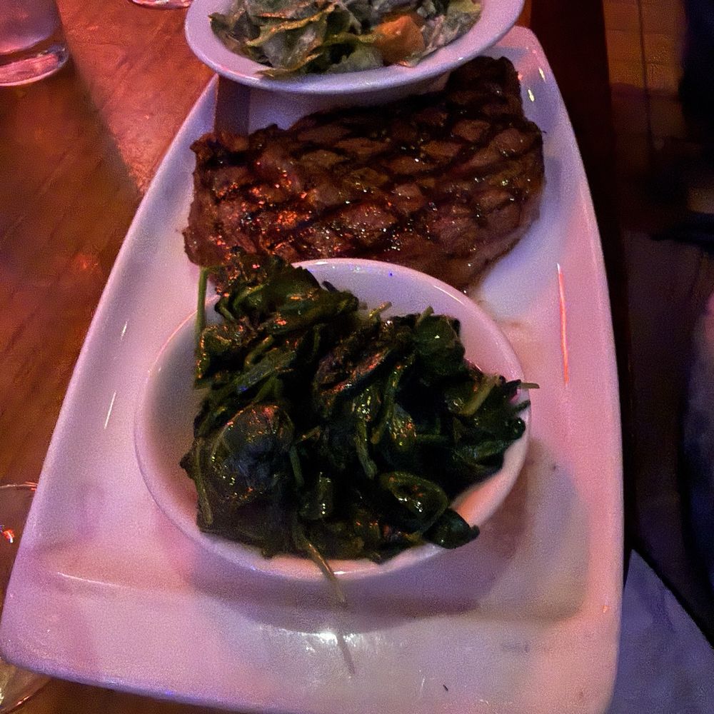 Ribeye with 2 sides. (Caesar salad and sautéed spinach) Ribeye with 2 sides. (Caesar salad and sautéed spinach)