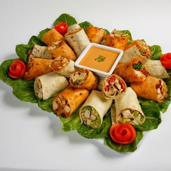 Muscle Maker Grill - a platter of rolls with dipping sauce - American Near Me - Turnersville, New Jersey Muscle Maker Grill - a platter of rolls with dipping sauce - American Near Me - Turnersville, New Jersey