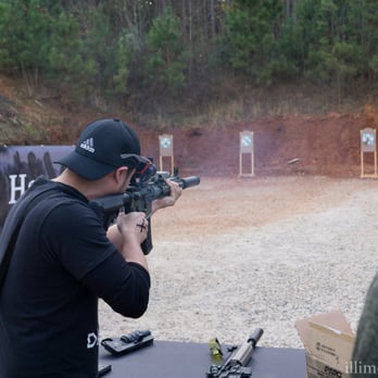 Griffin Gun Club - Shooting with a 5.56 AR15, and a casing being ejected, flying out. - Gun/Rifle Ranges Near Me - Griffin, Georgia