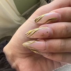 Glamour Studios - Gold chipping off. After growth you can see how sloppy the nail work is & can see where gel polish was over extended on the skin