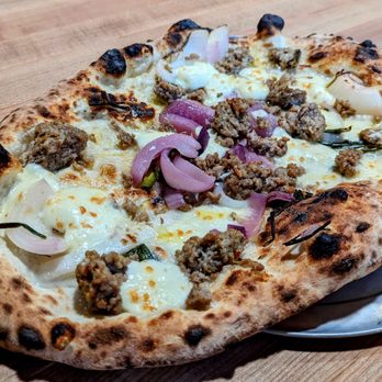 Osteria DOP - a pizza with meat and onions - Italian Near Me - Eugene, Oregon Osteria DOP - a pizza with meat and onions - Italian Near Me - Eugene, Oregon