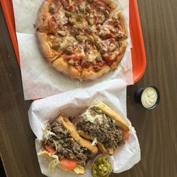 Super steak sandwich. Meat lovers pizza Super steak sandwich. Meat lovers pizza