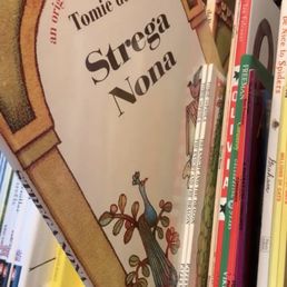 A copy of Tomie dePaola's "Strega Nona" from the Kids Section of An Unlikely Story