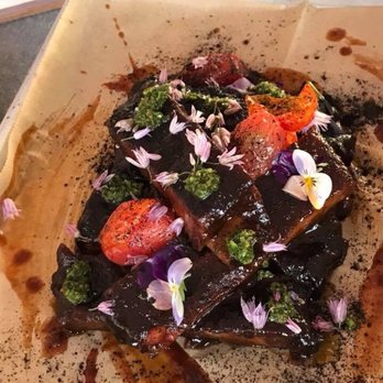 Ore Nell's Barbecue - BBQ Chimicurri Ribs: Blistered tomatoes, vegetable ash, micro arugula - American Near Me - Kittery, Maine Ore Nell's Barbecue - BBQ Chimicurri Ribs: Blistered tomatoes, vegetable ash, micro arugula - American Near Me - Kittery, Maine