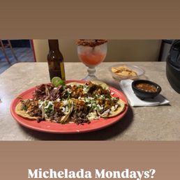 Carne Asada and Al Pastore tacos and a Michelada Carne Asada and Al Pastore tacos and a Michelada