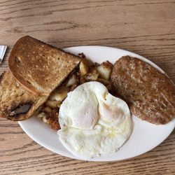 Monte's Just A Bite Cafe - Two eggs over easy with sausage and sourdough