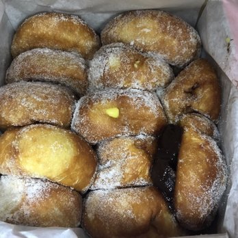 Leonard's Bakery - A dozen mixed Malasadas with an oddly misplaced gob of chocolate filling? - Bakeries Near Me - Honolulu, Hawaii Leonard's Bakery - A dozen mixed Malasadas with an oddly misplaced gob of chocolate filling? - Bakeries Near Me - Honolulu, Hawaii
