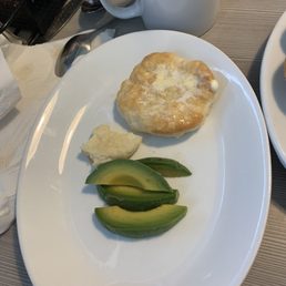 Smallest avocado I've ever seen next to a small biscuit. Rubber texture. Smallest avocado I've ever seen next to a small biscuit. Rubber texture.