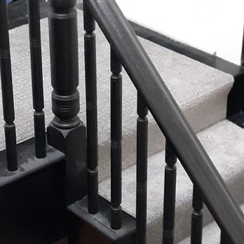 Minuteman Floors - a staircase with black railings - Flooring Near Me - Manchester, New Hampshire Minuteman Floors - a staircase with black railings - Flooring Near Me - Manchester, New Hampshire
