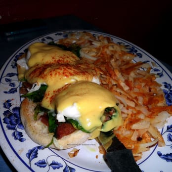 Pete's Egg Nest - Eggs Benedict with fresh spinach + bacon, served with hash browns. - Breakfast & Brunch Near Me - Seattle, Washington
