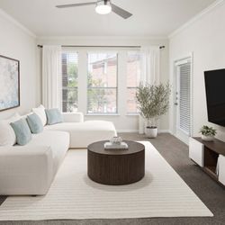 Camden Centreport Apartments - Living room with large windows and balcony access at Camden Centreport apartments in Fort Worth, TX