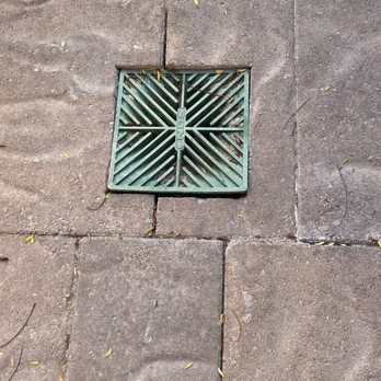Tnd Landscape Service - Poorly cut pavers around the drain cover. Cover doesn't even sit properly on the drain. - Landscaping Near Me - Santa Clara, California