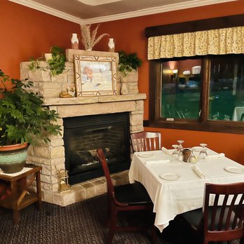 Red Fox Restaurant - a dining room with a fireplace - Seafood Near Me - Saranac Lake, New York