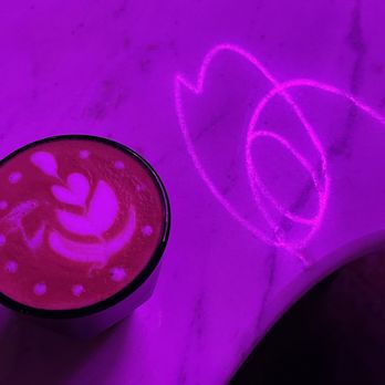 KnuckleBones Elixir - A delicious Cortado under the fabulous neon ambiance - Coffee & Tea Near Me - Mobile, Alabama