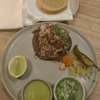 Suerte - CARNITAS confit pork, refried tallow black beans, jalapeño salsa cremosa, escabeche, tortillas - Mexican Near Me - Austin, Texas