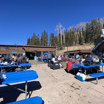 Agassiz Lodge Restaurant - a group of people sitting at picnic tables - New American Near Me - Flagstaff, Arizona