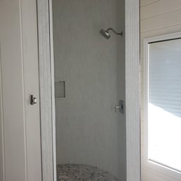 Beautifully tiled circular master bath shower by Affordable Flooring Warehouse. Beautifully tiled circular master bath shower by Affordable Flooring Warehouse.
