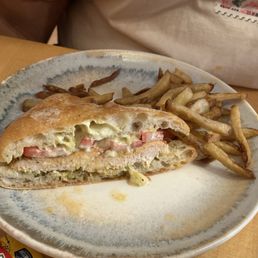 Chicken pesto sandwich (half already eaten) Chicken pesto sandwich (half already eaten)