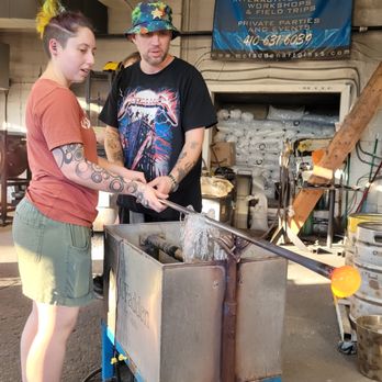 McFadden Art Glass - Jeremy cooling the rod so he could handle it after it had been in the oven - Party & Event Planning Near Me - Baltimore, Maryland