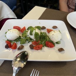 Mozzarella, tomatoes, basil, and olives