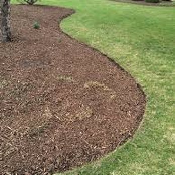 Troy's Lawns - a mulch bed in the front yard - Lawn Services Near Me Troy's Lawns - a mulch bed in the front yard - Lawn Services Near Me