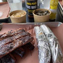 Half rack of ribs, mild and hot sausages, collard greens, Mac and cheese Half rack of ribs, mild and hot sausages, collard greens, Mac and cheese