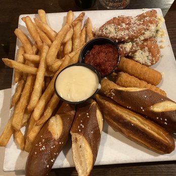 Arsenal City Tavern - Appetizer plate with pretzel sticks, mozz sticks, chicken tenders, and they let let me sub out the egg roll for fries instead! - Pubs Near Me - Watervliet, New York Arsenal City Tavern - Appetizer plate with pretzel sticks, mozz sticks, chicken tenders, and they let let me sub out the egg roll for fries instead! - Pubs Near Me - Watervliet, New York