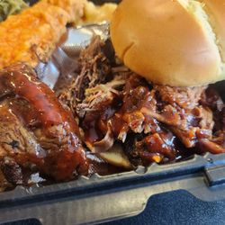No Sauce Que - Close up of the brisket Sammy and a wing I snuck from the table photo bombed by the fish
