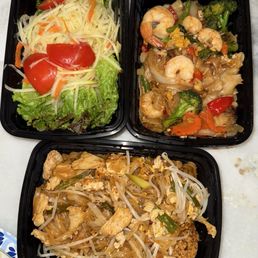 Papaya salad, shrimp drunken noodles and chicken pad Thai Papaya salad, shrimp drunken noodles and chicken pad Thai