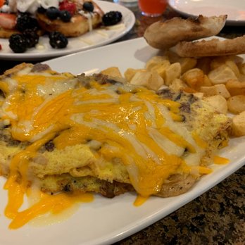 Another Broken Egg Cafe - THE SUPREME OMELETTE Sausage, bacon, onions and mushrooms omelette, topped with Cheddar Jack cheese. - Breakfast & Brunch Near Me - Pembroke Pines, Florida