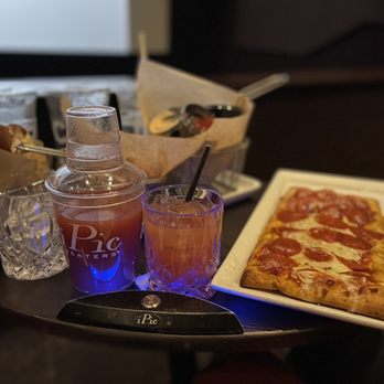 IPIC Fort Lee - a pizza and drinks on a table - Cinema Near Me - Fort Lee, New Jersey IPIC Fort Lee - a pizza and drinks on a table - Cinema Near Me - Fort Lee, New Jersey