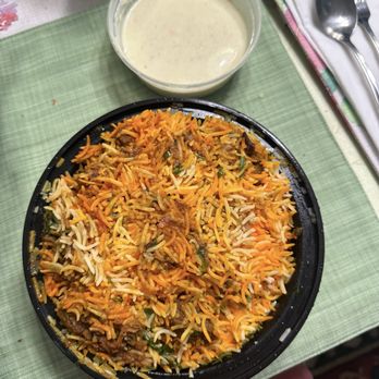 Lassan - Indian Restaurant & Bar - Lamb Biryani with yogurt sauce to-go - Indian Near Me - Burke, Virginia