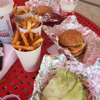 Five Guys - Fries are huge so share or get a small.  These are cajun and regular.  2 "single" cheese burgers which are huge, and a protein style burger - Burgers Near Me - Kapolei, Hawaii