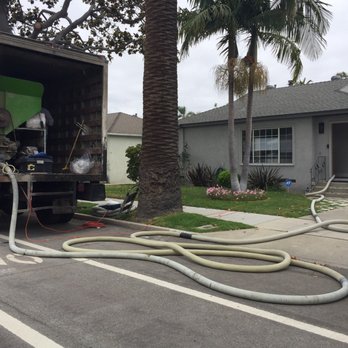 Everguard Home Insulation - Hose transporting insulation from truck to house. - Insulation Installation Near Me - Orange, California Everguard Home Insulation - Hose transporting insulation from truck to house. - Insulation Installation Near Me - Orange, California