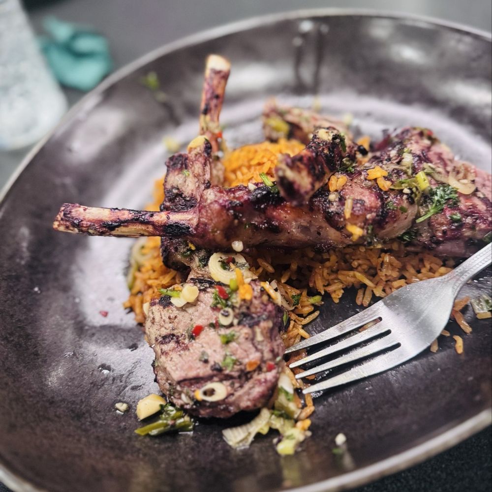 Allure Lounge - Lamp chops with jollof rice - Restaurants Near Me - Orlando, Florida Allure Lounge - Lamp chops with jollof rice - Restaurants Near Me - Orlando, Florida
