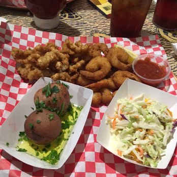 Shells Seafood - Brandon - Fried Trio (Shrimp, Scallops and Clams) with Parsley Potatoes and Mandarin Slaw - Seafood Near Me - Brandon, Florida Shells Seafood - Brandon - Fried Trio (Shrimp, Scallops and Clams) with Parsley Potatoes and Mandarin Slaw - Seafood Near Me - Brandon, Florida