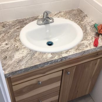 Lawton Construction - a bathroom sink with a marble countertop - General Contractors Near Me - Roseburg, Oregon Lawton Construction - a bathroom sink with a marble countertop - General Contractors Near Me - Roseburg, Oregon