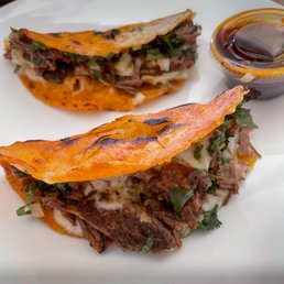 two tacos on a white plate