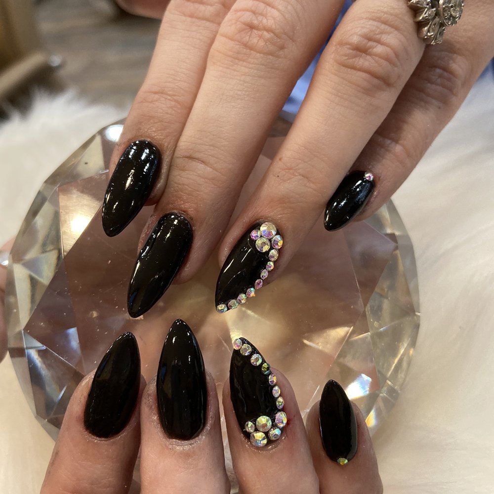 Black dip powder almond shape with crystals!