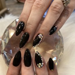 Black dip powder almond shape with crystals!