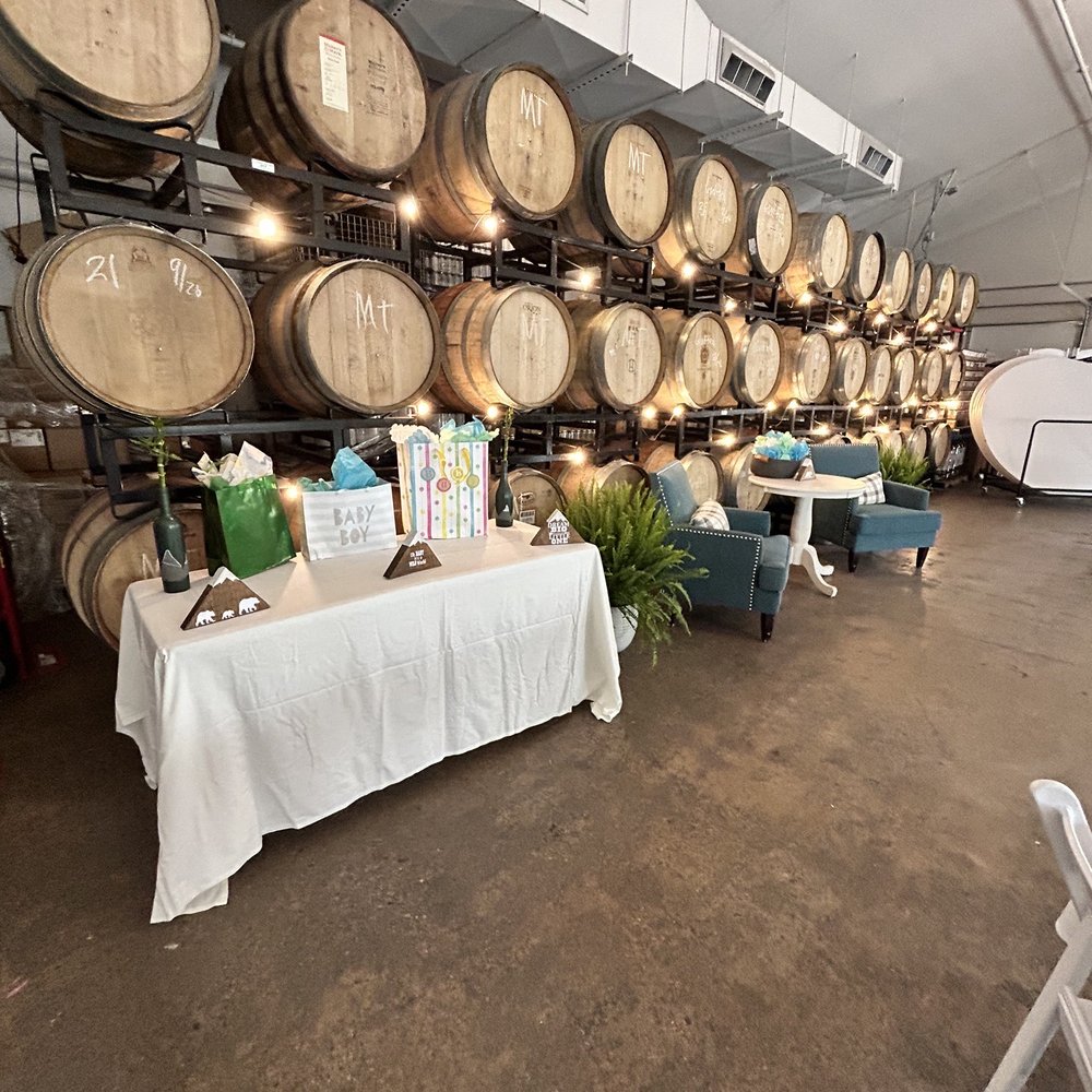Barrel + Beam - Gift table and unwrapping station in front of the barrels - Breweries Near Me - Marquette, Michigan
