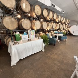 Barrel + Beam - Gift table and unwrapping station in front of the barrels